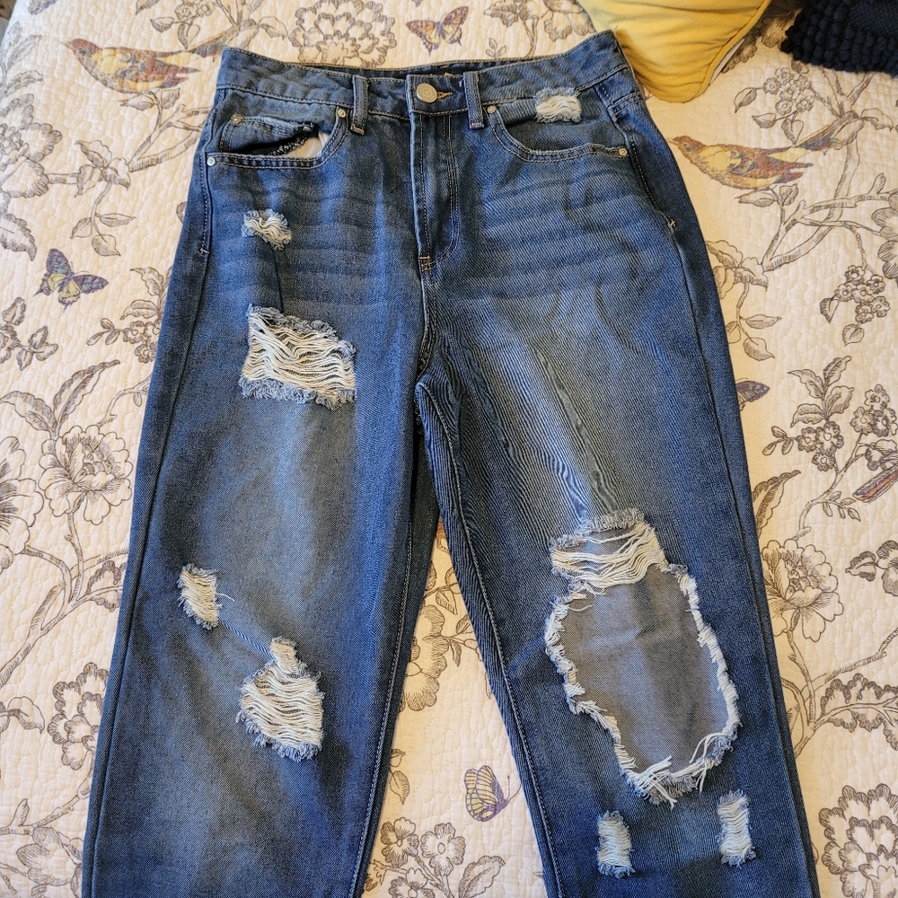 Distressed blue jeans